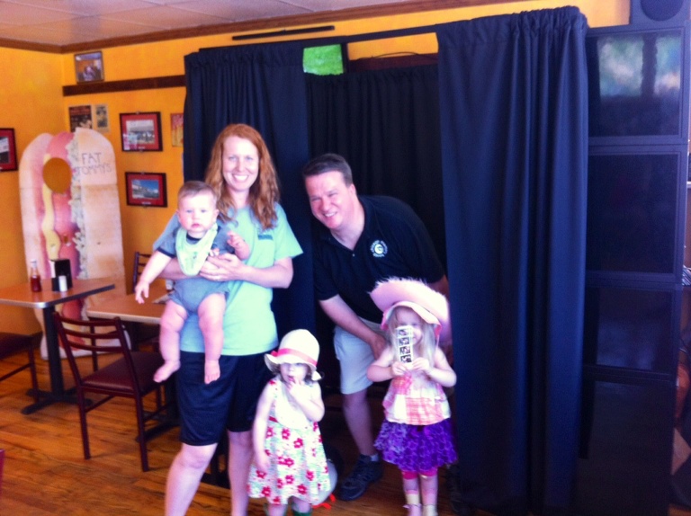 family of 5 enjoying a photo booth rental chicago