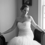 she looks at photographer while waiting to get married